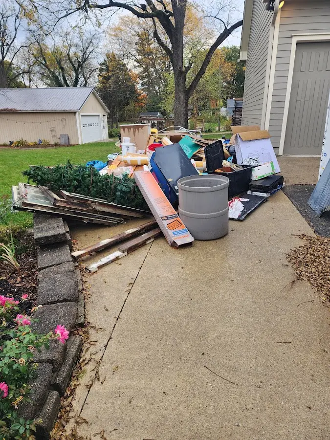 Dumpster being loaded with debris for 3 Yard Dumpster Rental in Bridgeport